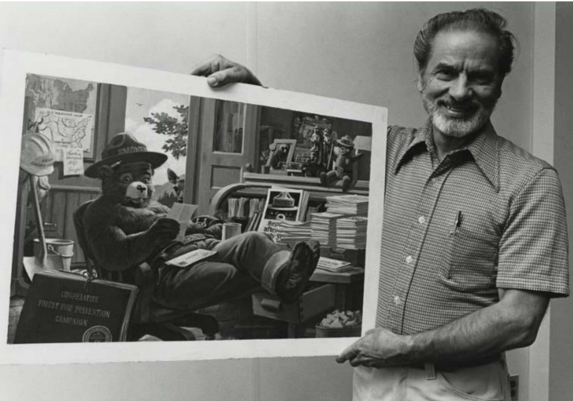 Rudy Wendelin with one of his Smokey Bear paintings.