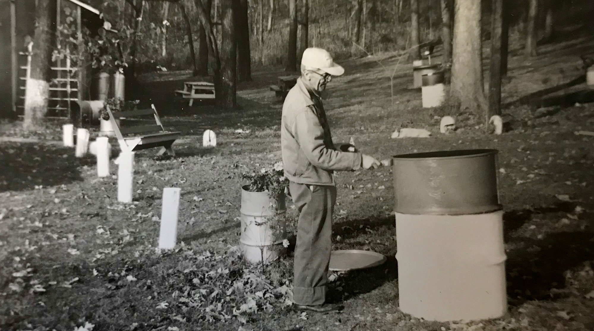 Arthur Sage painting an oil drum used as garbage receptacles in the preserve. 