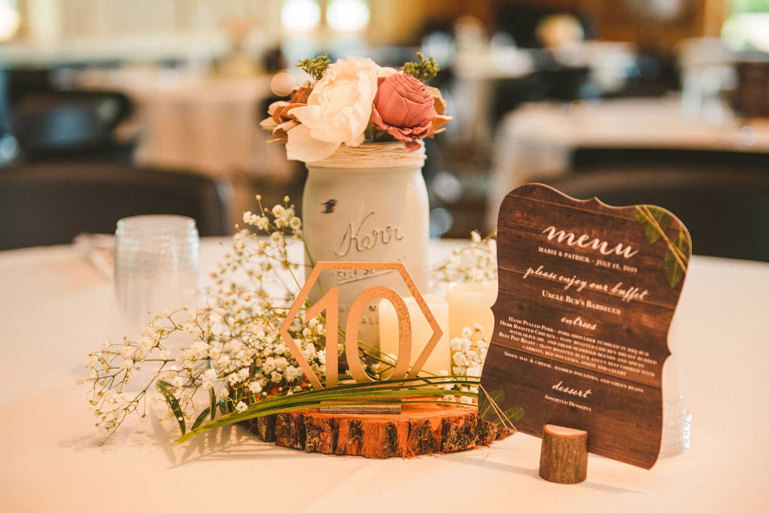 Table arrangement set up on table at wedding.