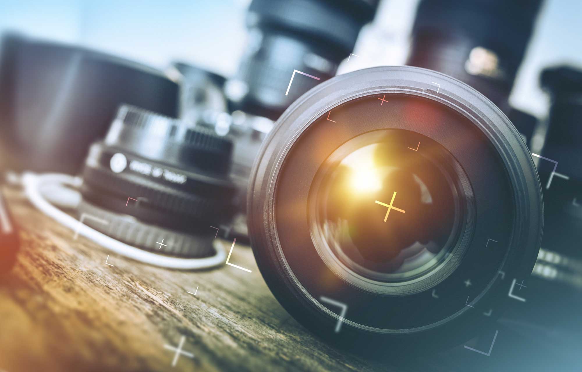 A stock image of a professional camera on a blue background