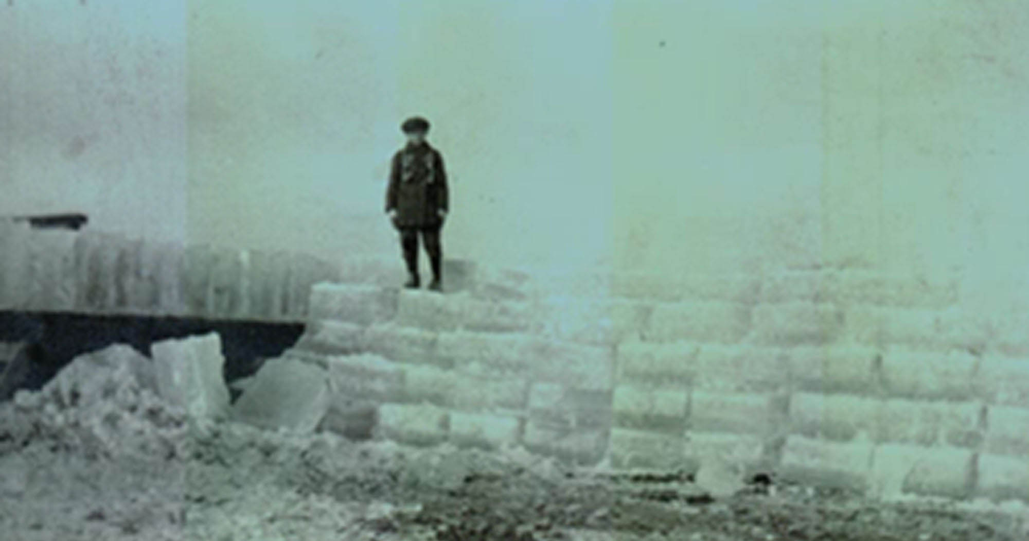 A boy standing on ice.