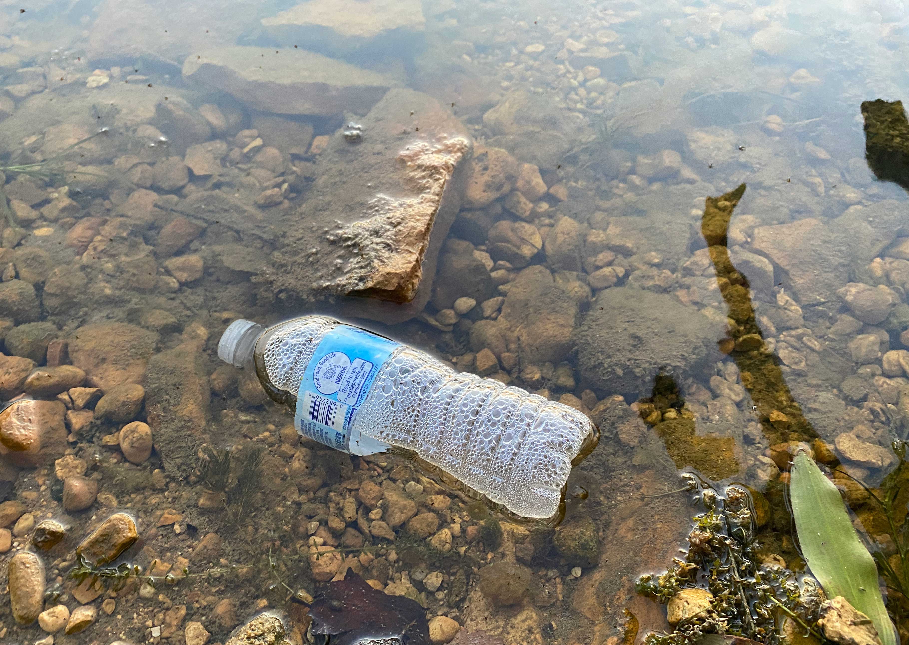 A plastic bottle in water.