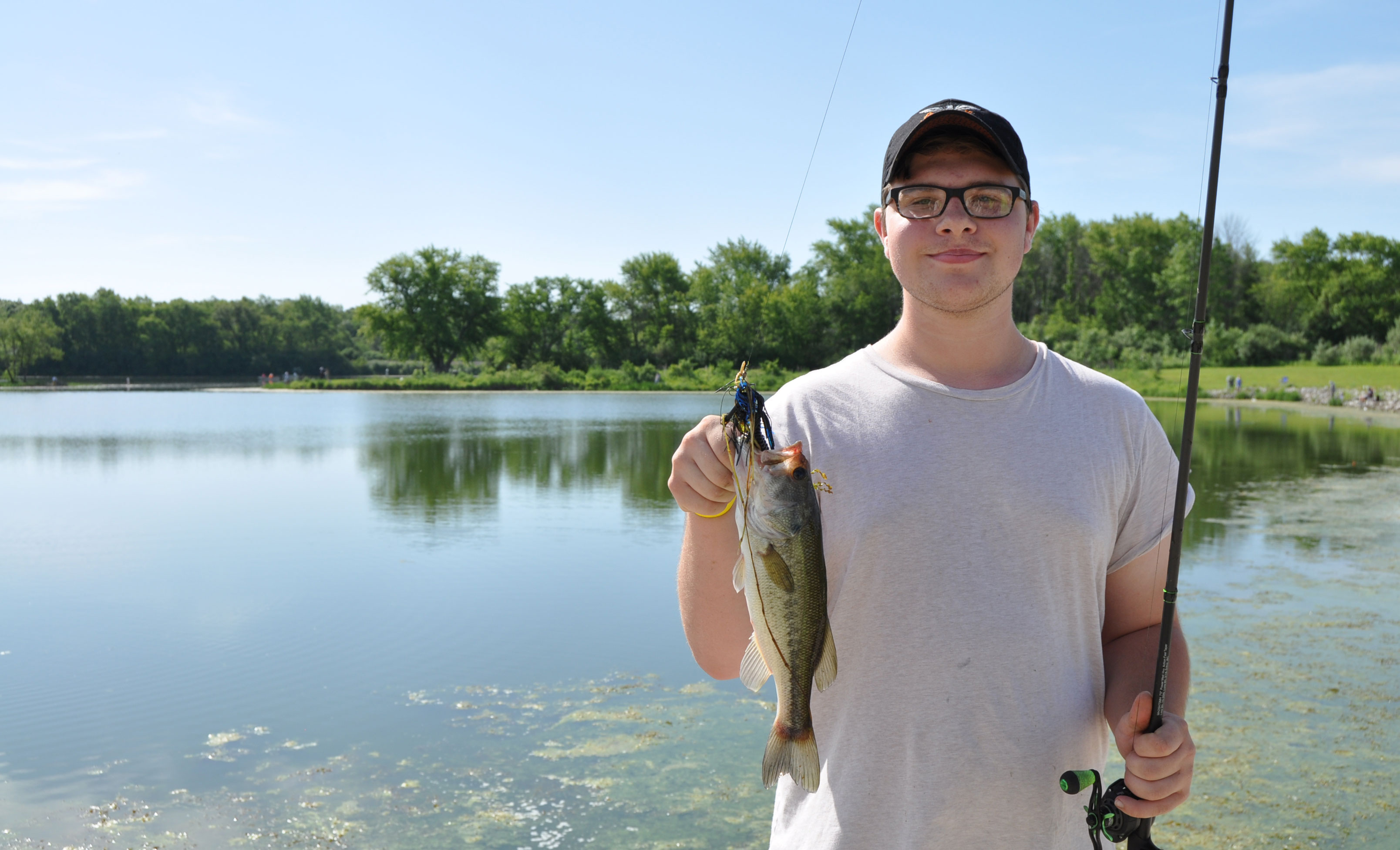 A preserve visitor holding a largemouth bass.