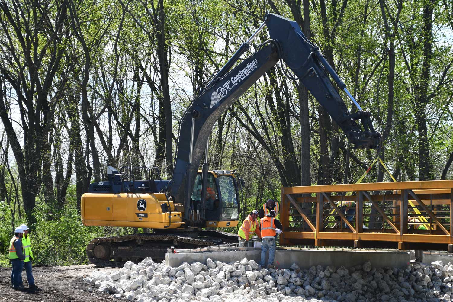 Construction workers working on bridge.