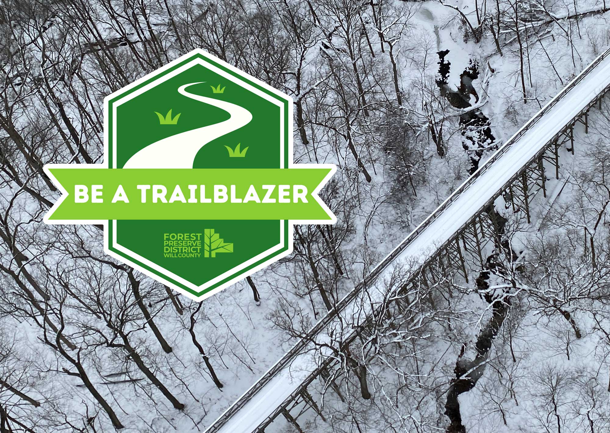 Aerial view of snowy trail with logo