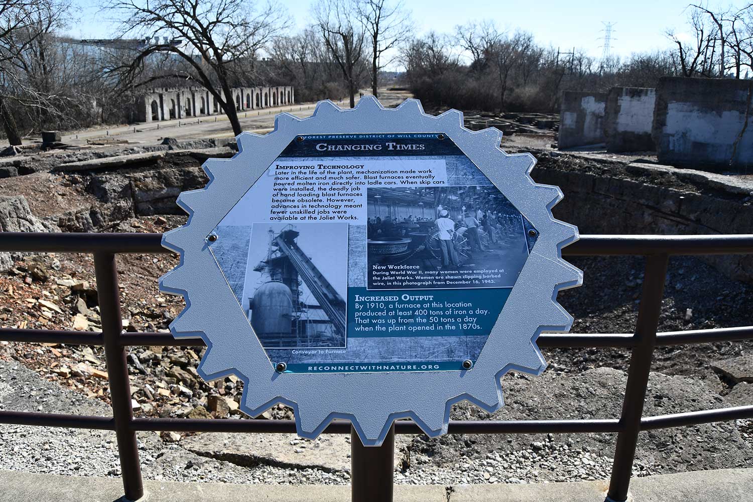 An interpretive sign detailing the work done at the sight of an old steel mill.