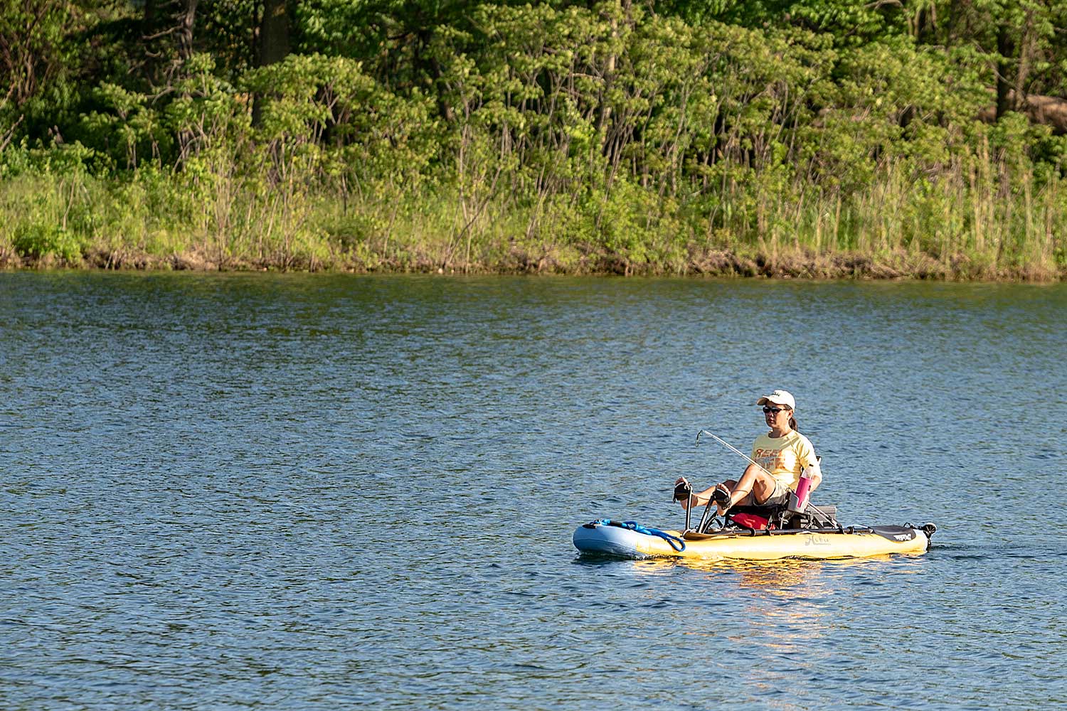 A person kayaking in a lake. 