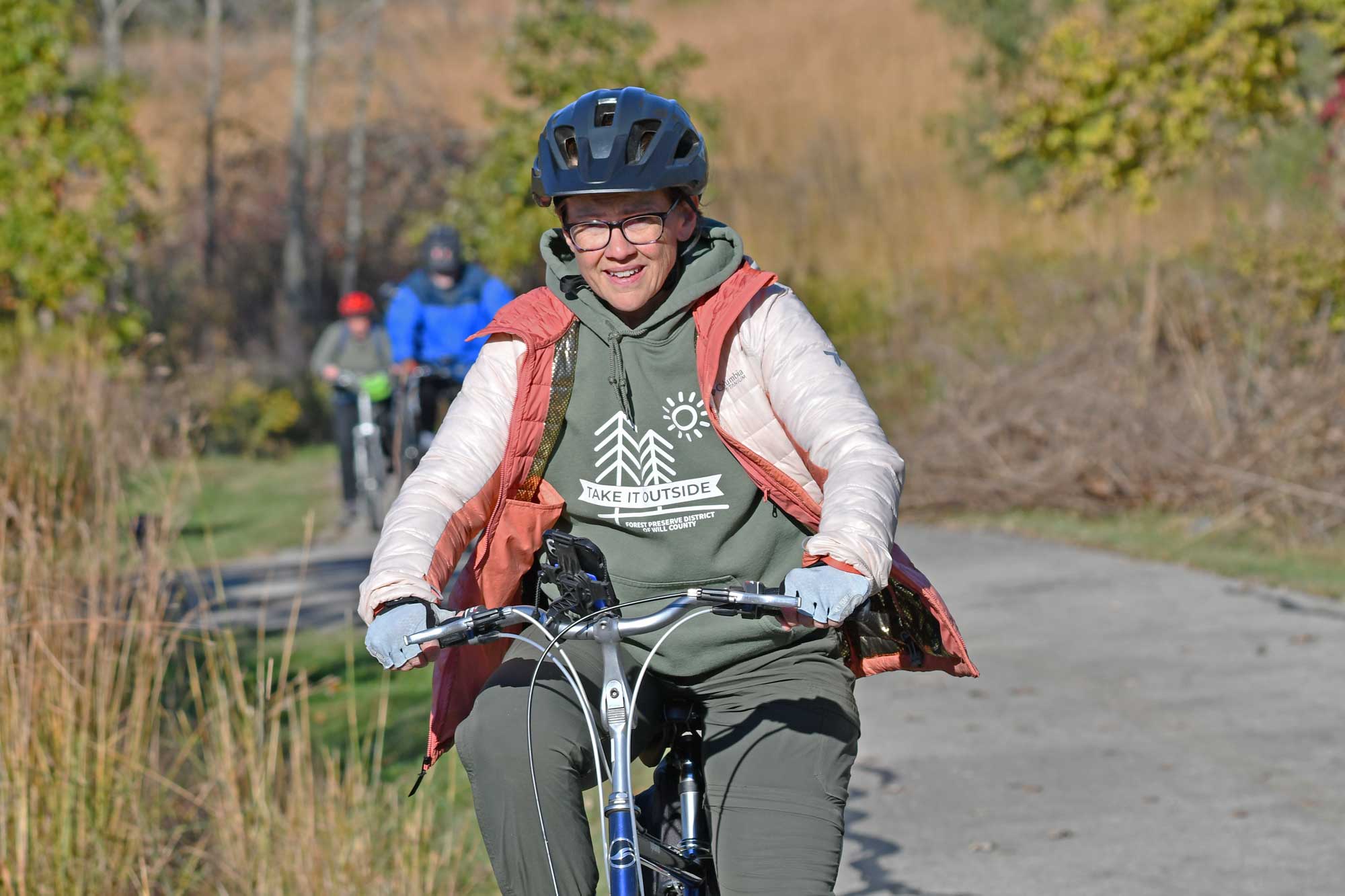 A woman rides a bike