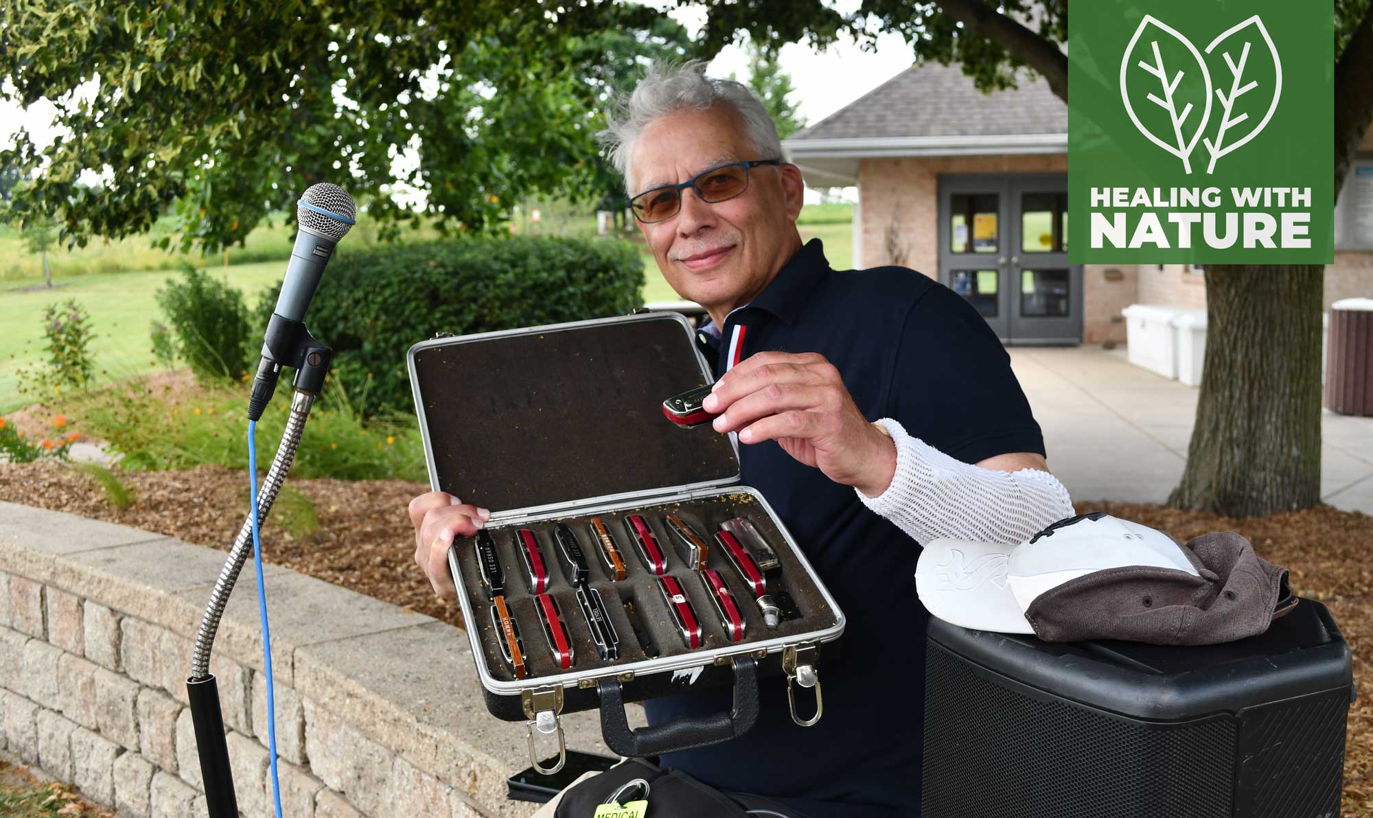 A man shows off his harmonicas.