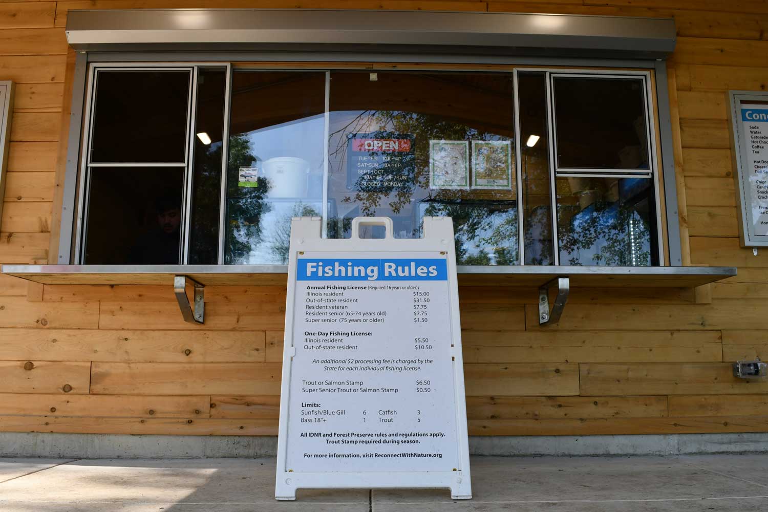 Sign sitting out in front of bait shop.