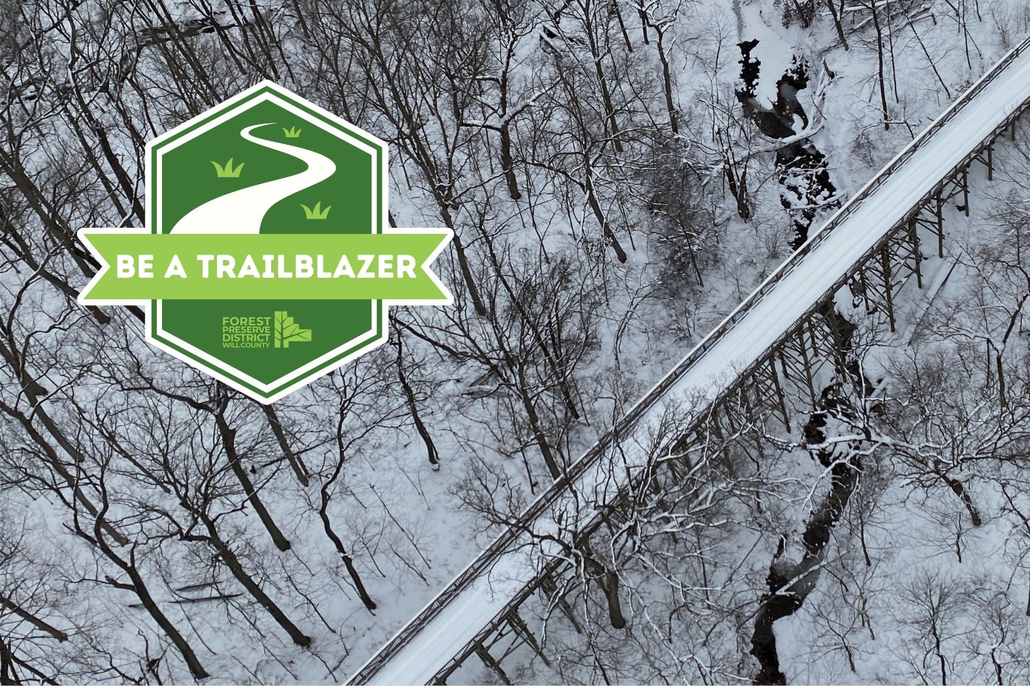 Aerial view of snowy trail with logo